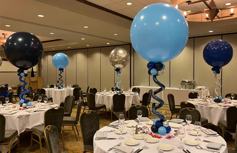 Blue and silver balloon centerpieces for birthday dinner