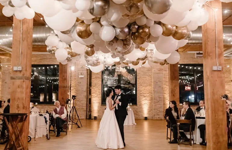 Organic balloon design on ceiling for wedding reception