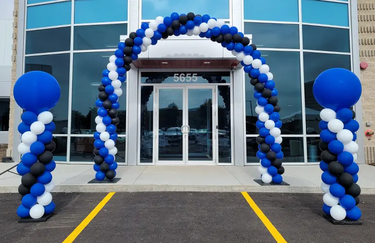 Outdoor balloon arch and columns for a grand opening