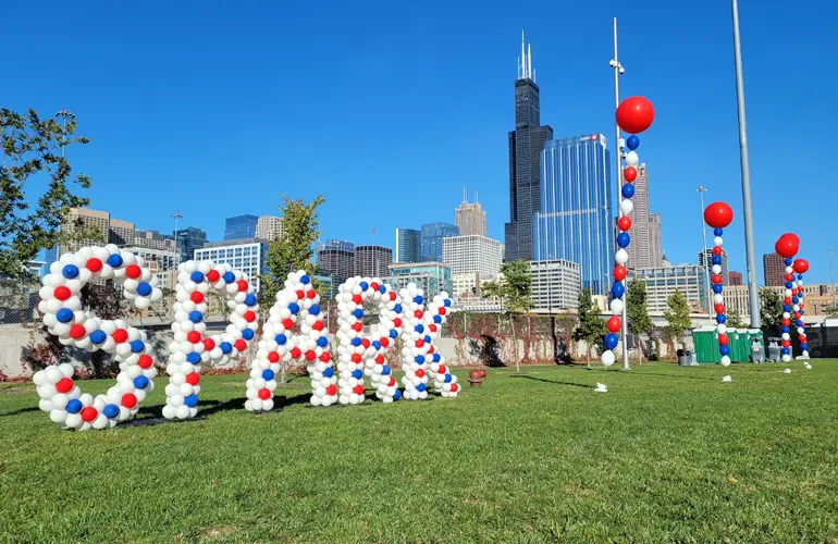 UIC Spark event with outdoor bead columns and custom sculpted balloon letters