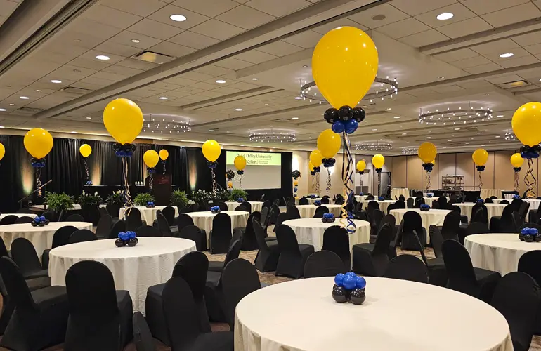 Helium balloon centerpieces for a company meeting