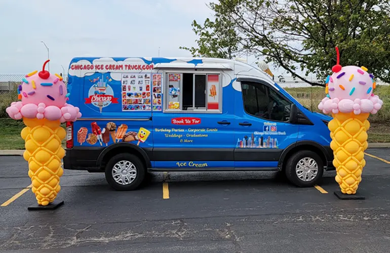 Ice Cream cones placed around an ice cream truck to attract attention