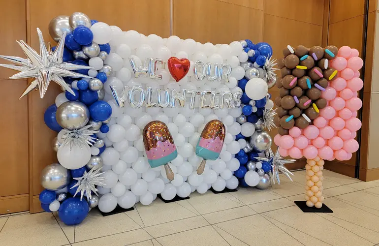Balloon wall and popscicle sculpture for volunteer appreciation event