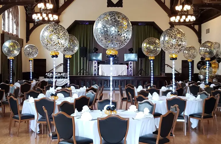 Confetti filled balloon centerpieces on light strands