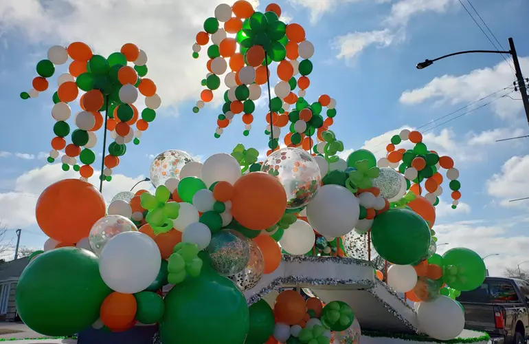 St. Patrick's Day parade float with balloons