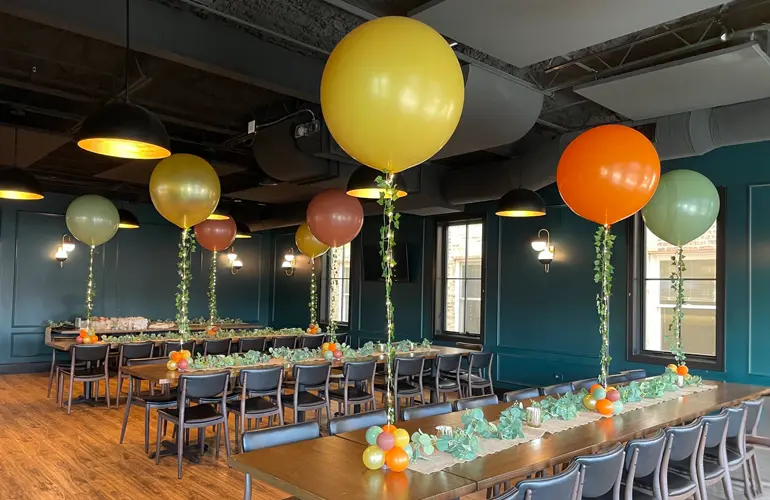 Indoor balloon centerpieces in fall colors