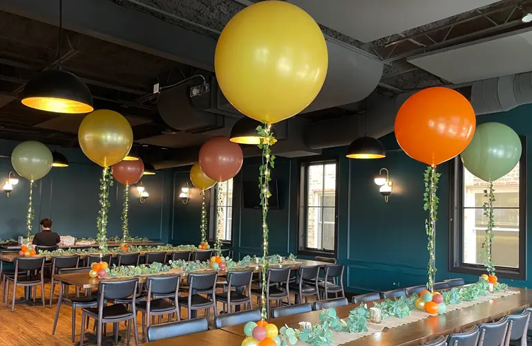 Balloon centerpieces with LED lights and ivy accents