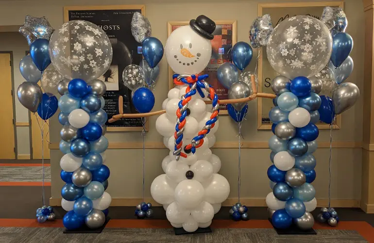 Snowman balloon sculpture with balloon columns