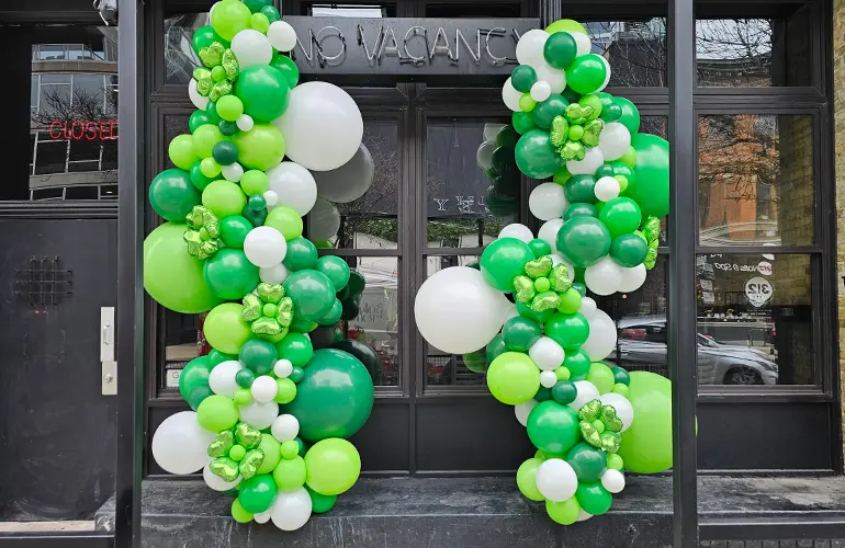 Organic balloon garlands hung outside a Chicago bar for St. Patrick's Day.