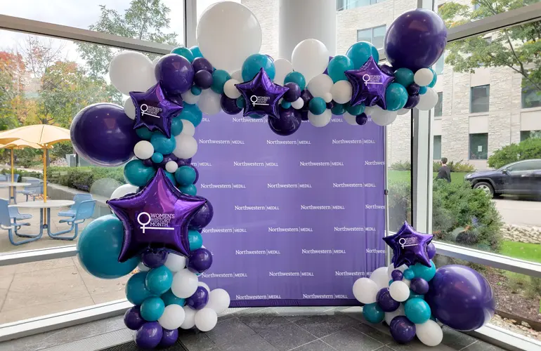 Trendy balloon arch with Women's History Month balloons