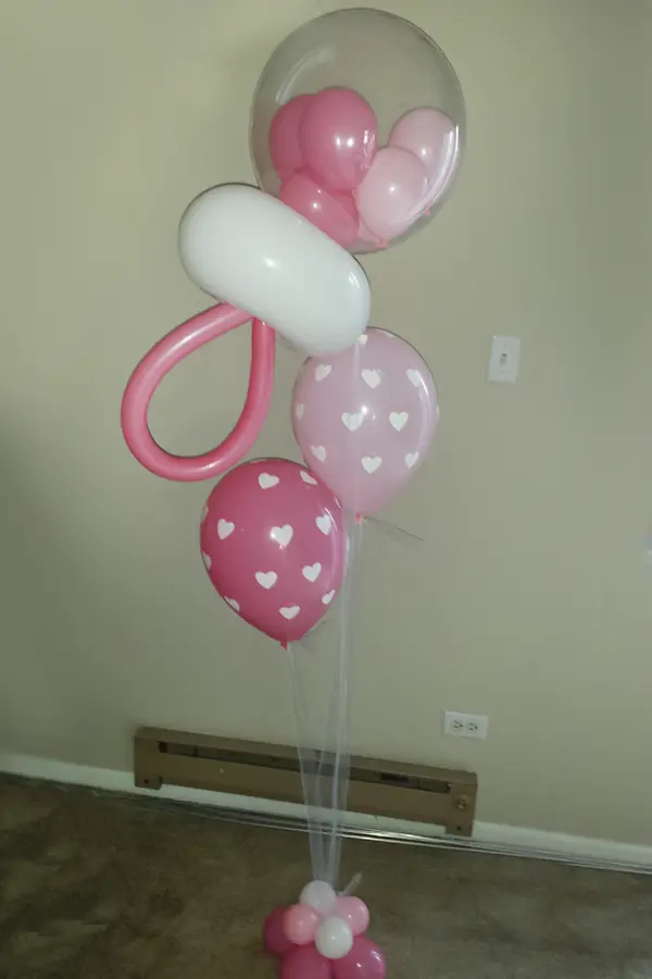 A bouquet of balloons with rattle accent