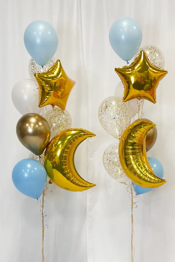 A bouquet of balloons with glitter and foil balloon accents