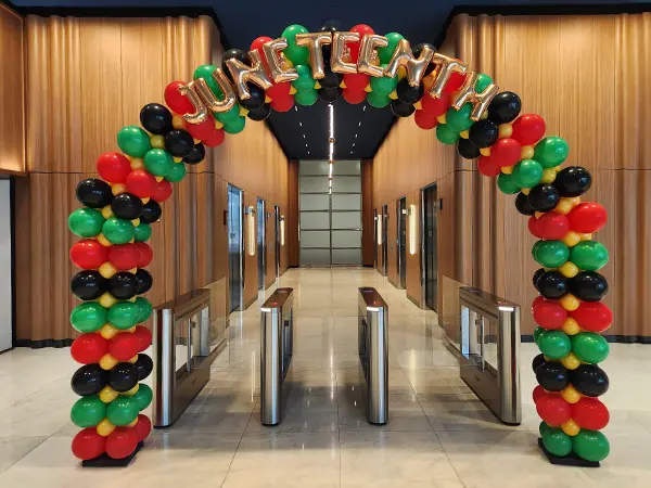 Square style balloon arch with lettering for Black History Month