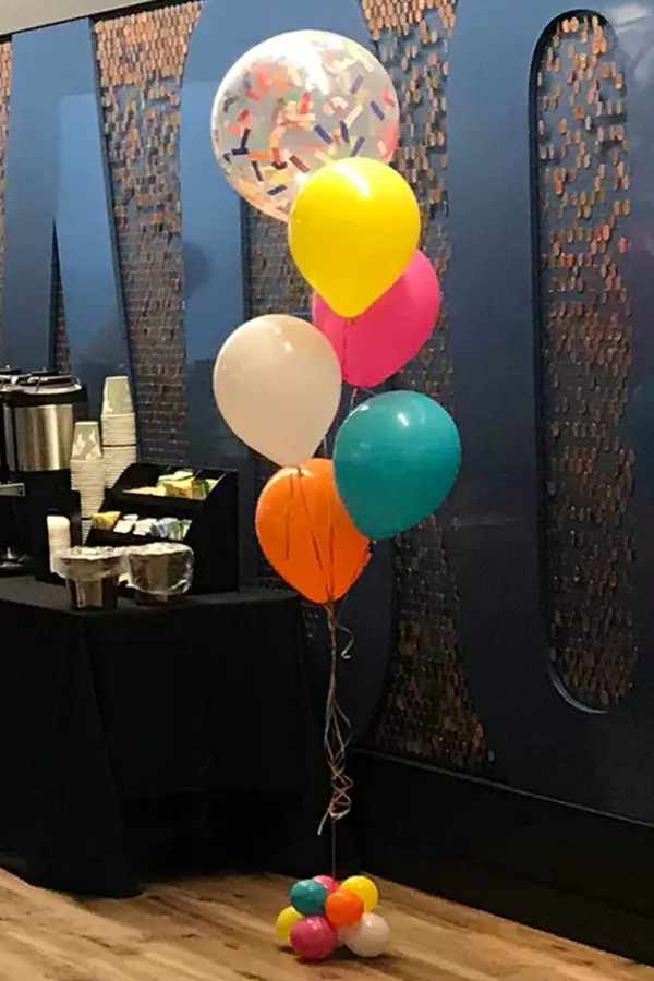 Balloon bouquet with a confetti balloon on top 