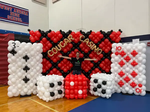 A hige balloon display for casino night themed events serving as both decor and photo backdrops