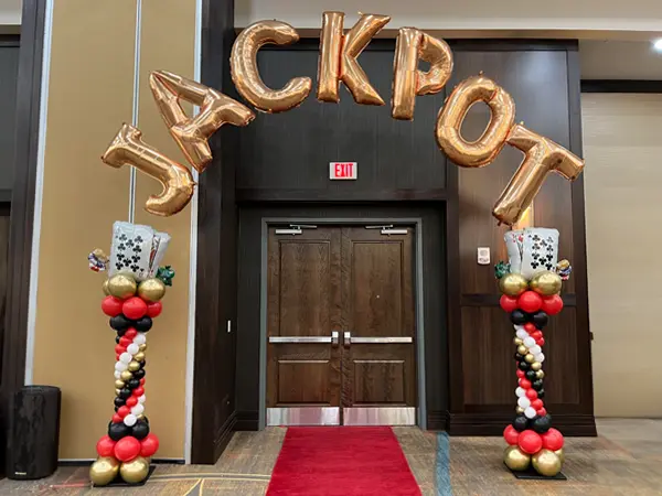 Roman style columns with helium filled foil JACKPOT letter balloons 