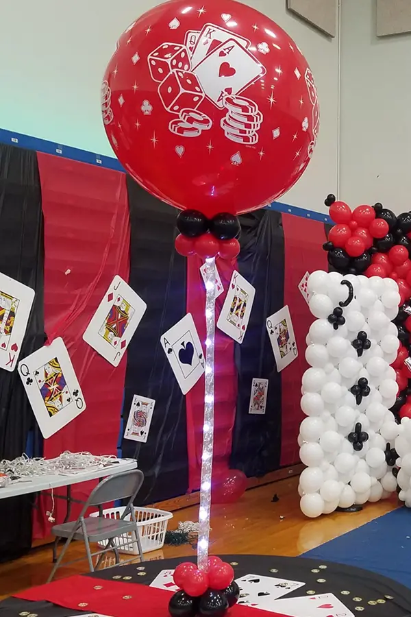 Jumbo round balloon with casino themed prints on led string with weight