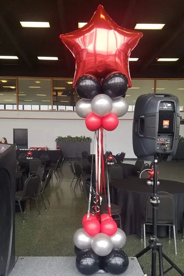 Foil topped balloon column with streamer accents