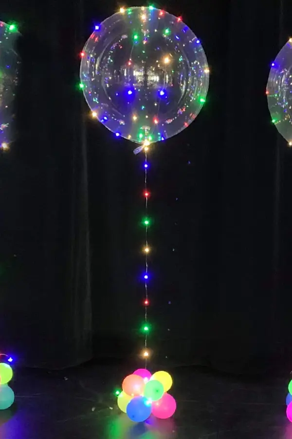 Multi color led lights wrapped around a 20inch balloon to create a fun look perfect for evening events