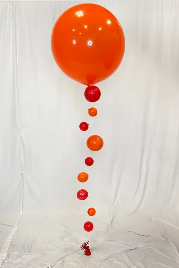 Jumbo helium filled balloon with a bubble look up the base of the centerpiece