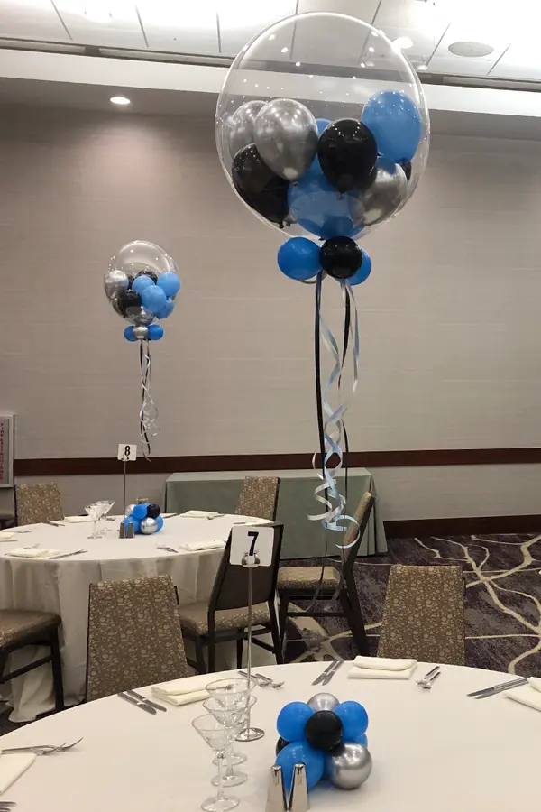 A fun helium filled balloon centerpiece with multiple smaller balloons inside to look like a gumball machine