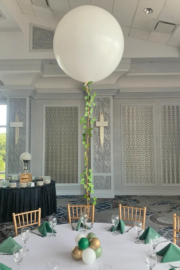 Trendy balloon centerpiece with ivy and led light accents