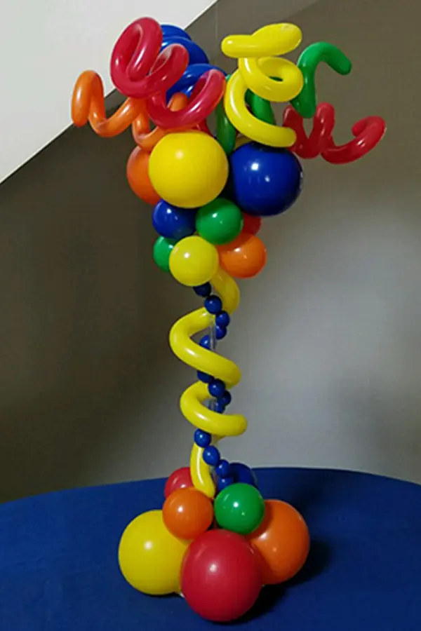 Tabletop squiggle pedestal centerpiece for birthday celebrations