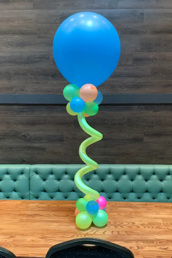 Helium filled balloon with a squiggle balloon accent