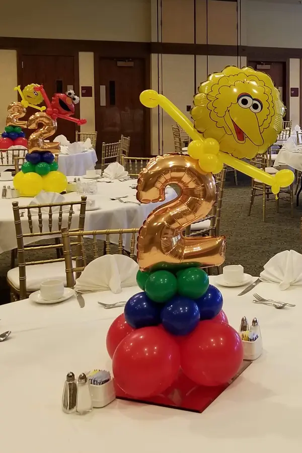 Character balloon centerpiece with foil number