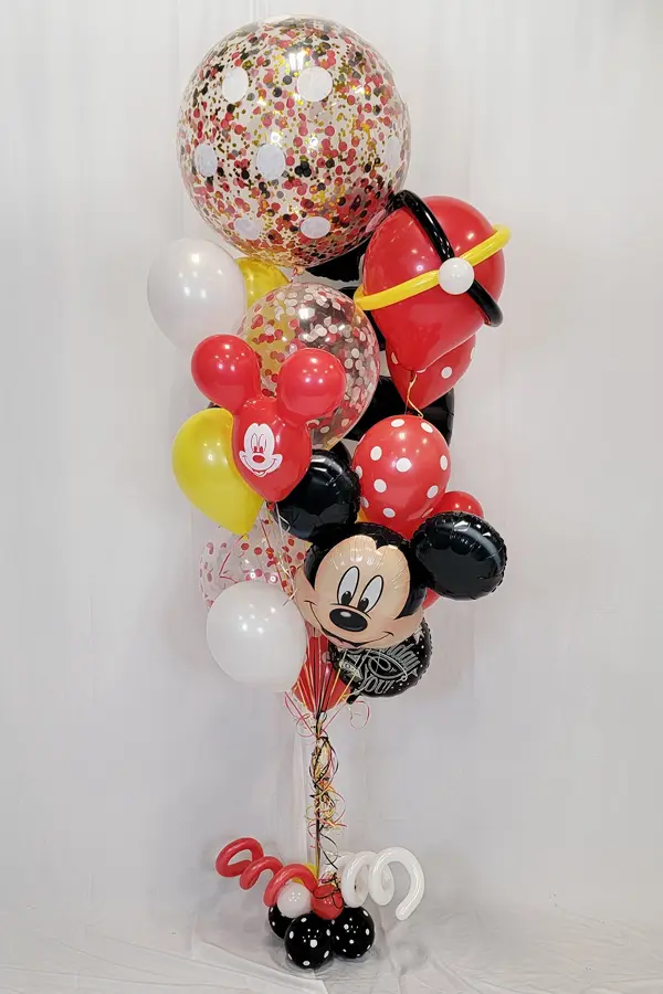 A whimsical balloon bouquet that uses multiple sized balloons