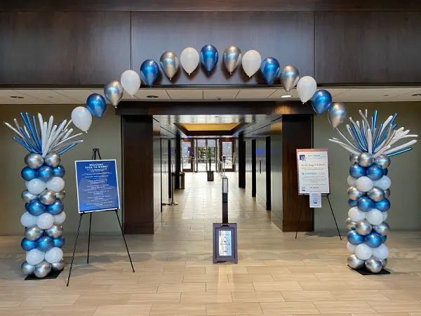Classic balloon columns with helium filled balloons creating a balloon arch