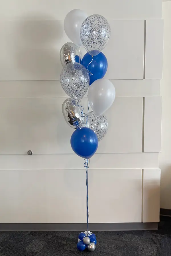 A trendy balloon bouquet with latex, foil, and glitter balloons.