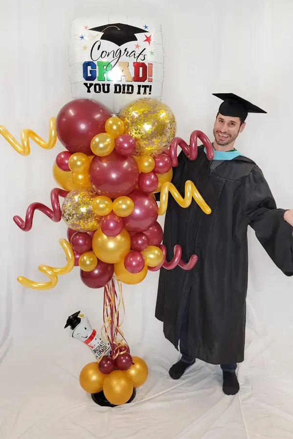 Party balloon column with glitter accents and foil shape topper