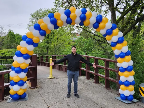 Wide outdoor classic balloon arch in school colors