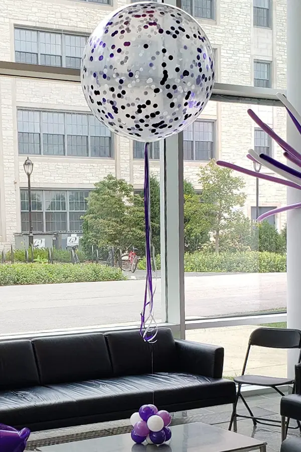 Single jumbo balloon full of helium and confetti for room decoration