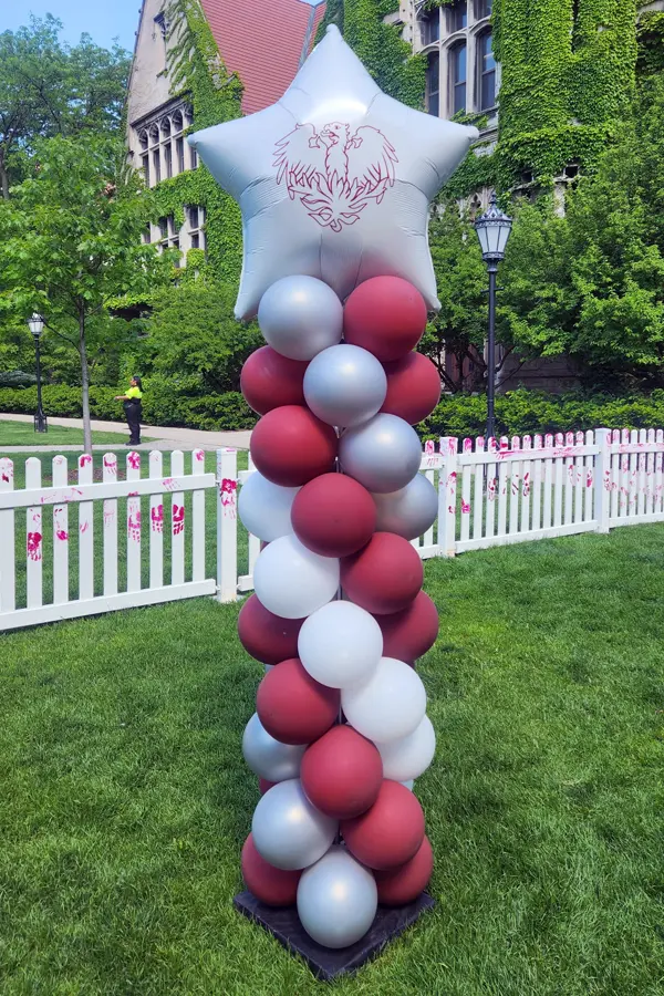 Classic balloon column with the University of Chicago phoenix logo added to the foil balloon topper