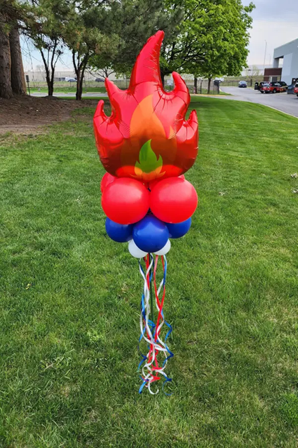 Balloon yard stick with foil flame balloon topper