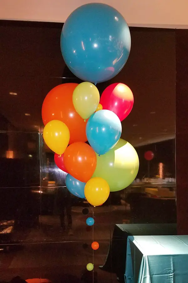 A larger than life balloon bouquet of multiple sized balloons