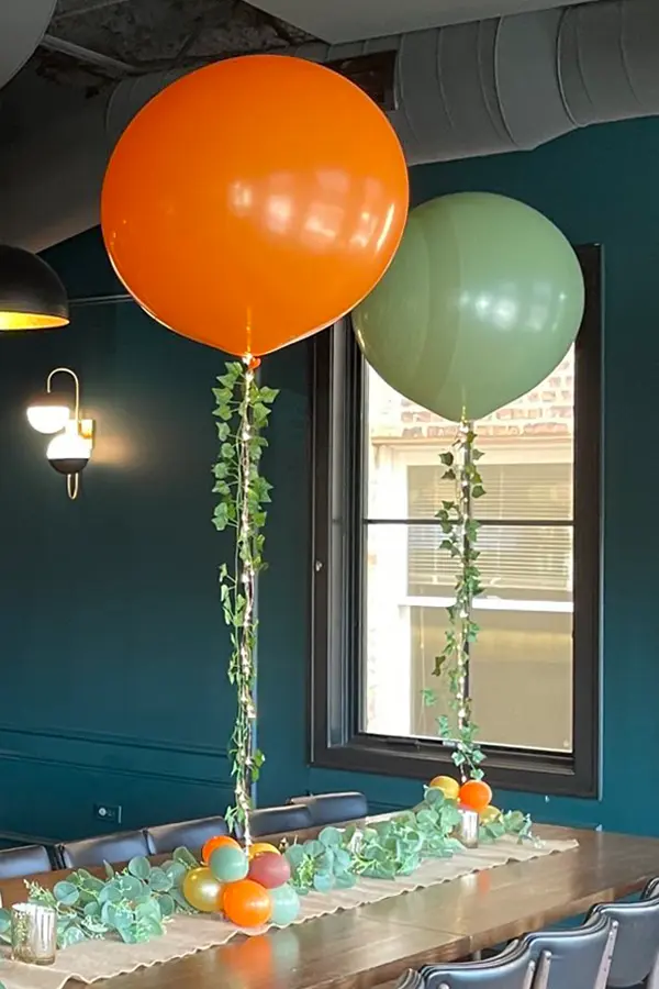 Helium filled jumbo balloon with ivy and led light accents