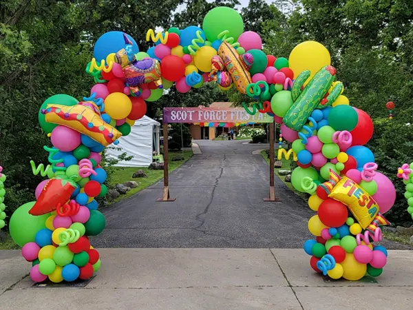 10ftx10ft Organic arched with fiesta themed foil balloon accents
