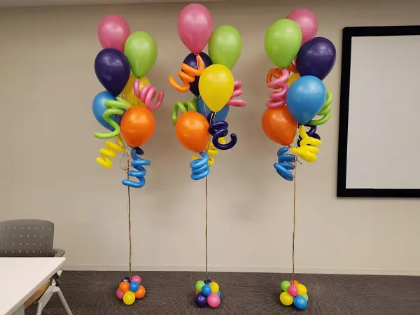 Balloon bouquet of bright colors with squiggle accents