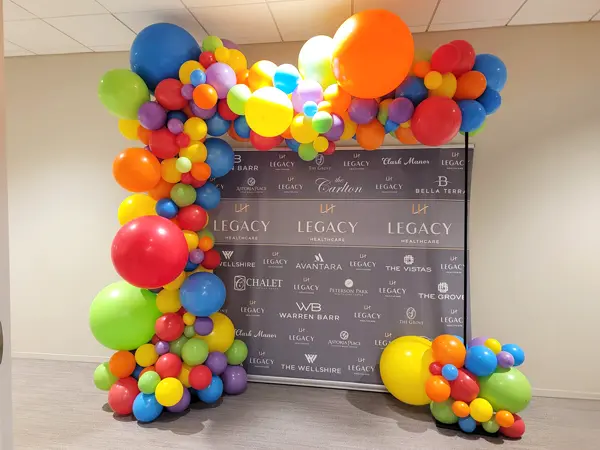 A trendy organic styled balloon arch