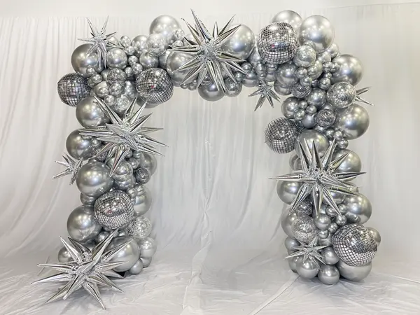 A stunning, highly customizable, and stylish balloon arch ideal for entryways or photo backdrop decorations