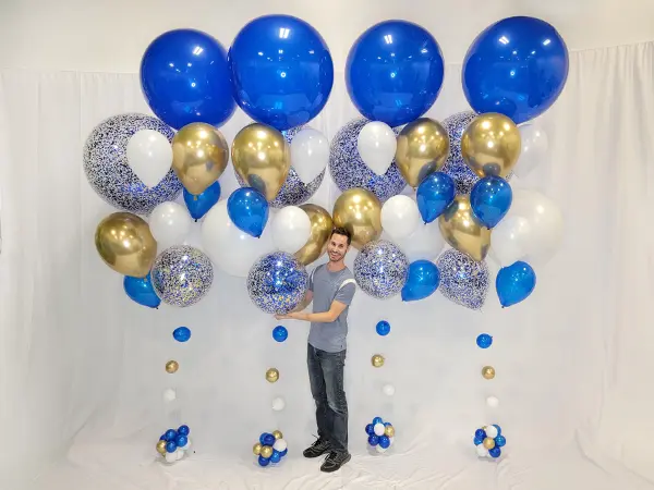 Larger than life balloon bouquet reaching 10ft tall using a mix of balloon sizes and glitter balloons