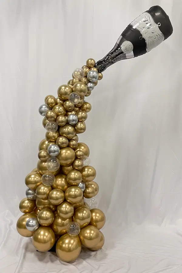 Pouring champagne column with glitter balloon accents
