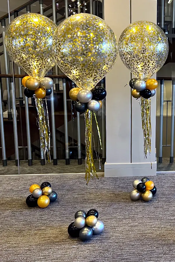 An 18inch balloon filled with glitter and helium to create a centerpiece