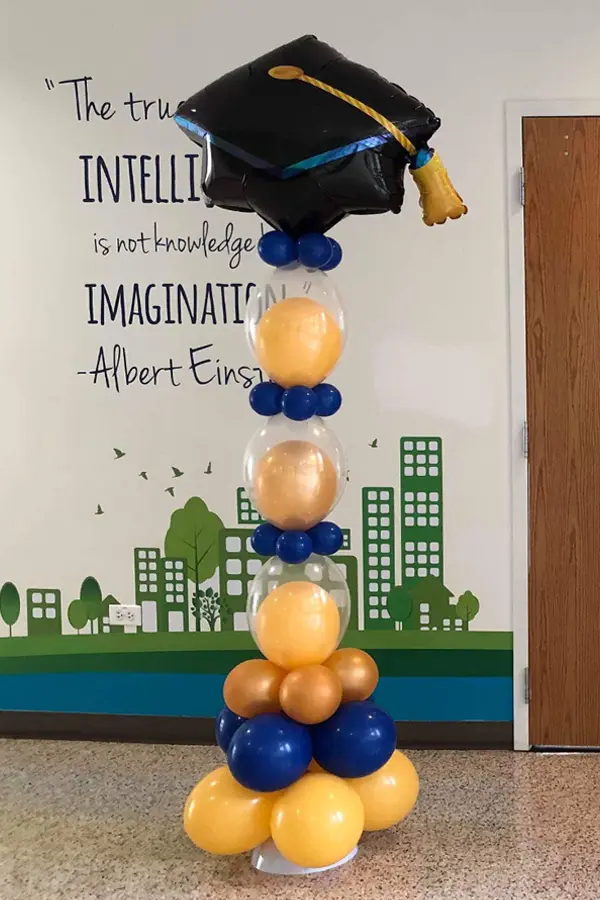 Indoor only balloon link skinny column with graduate cap balloon