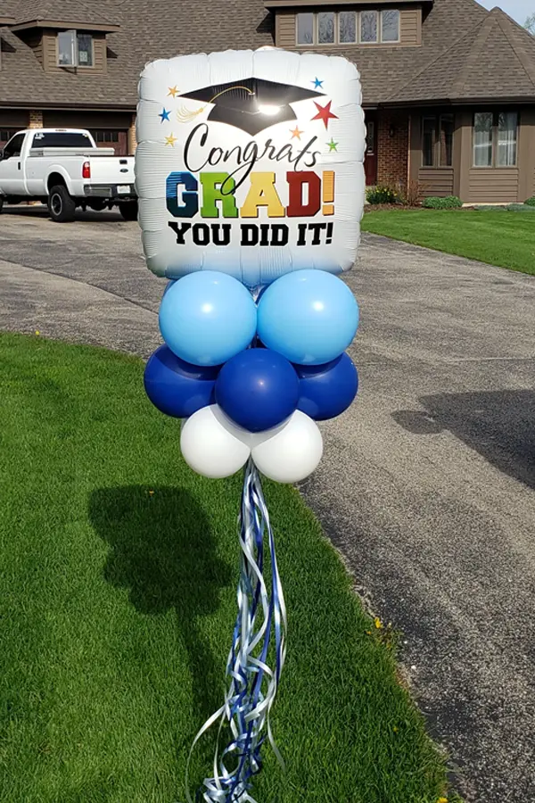 Yard decor with large air filled graduation foil balloon