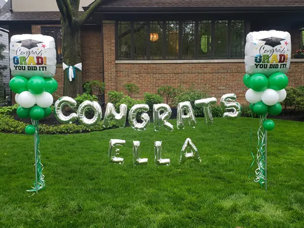 Yard balloon decor to celebrate your graduate