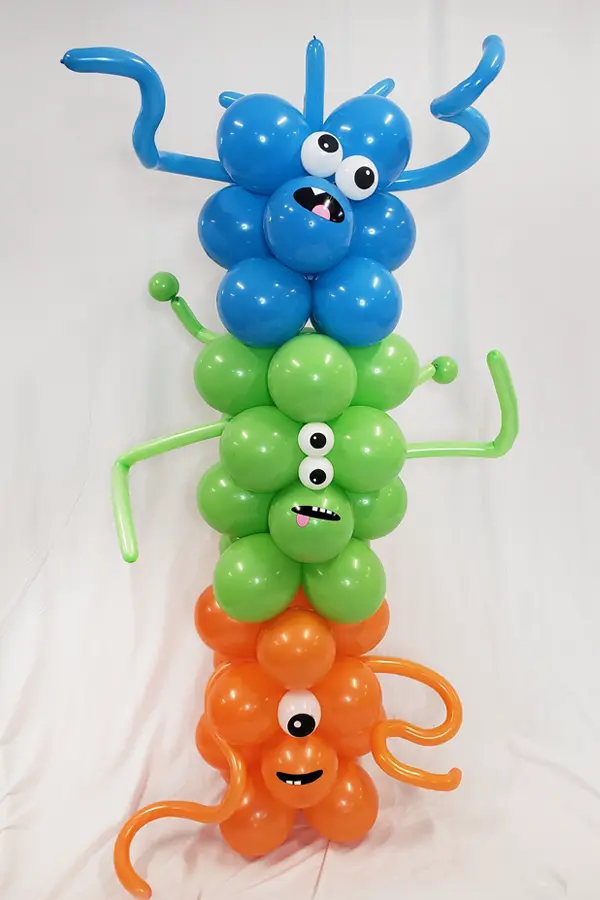 Stacked silly monster balloon column